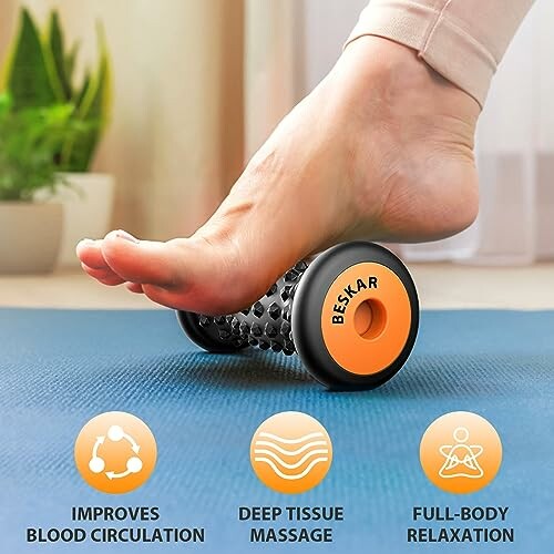 Foot using a massage roller on a mat for relaxation and circulation.