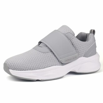 Gray slip-on sneaker with Velcro strap and white sole.