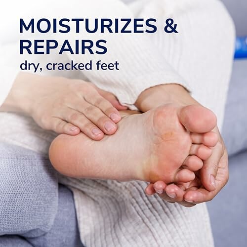 Person applying moisturizer to dry, cracked feet