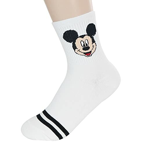 White sock featuring a cartoon character face and black stripes.